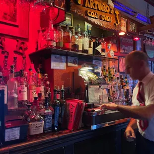a bartender at the bar