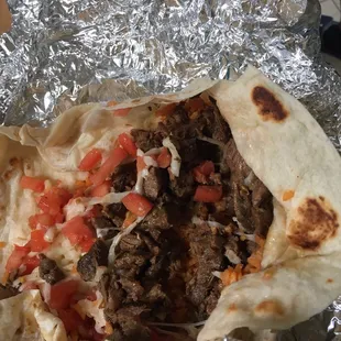 Steak burrito without lettuce, onions, and sour cream (normally comes w that)