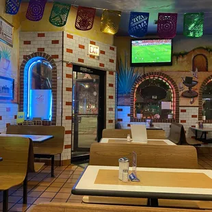 tables and chairs in a mexican restaurant