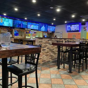 Inside, pretty comfy atmosphere with Indian TV everywhere