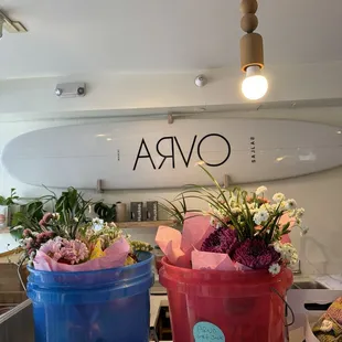 two buckets of flowers