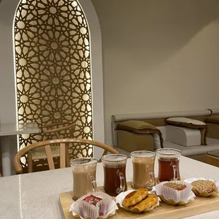 a tray of coffee and pastries