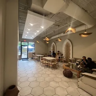 Back seating area with door to an outdoor seating courtyard shared with neighboring businesses