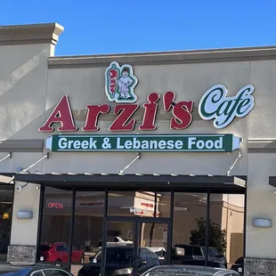 cars parked in front of the restaurant