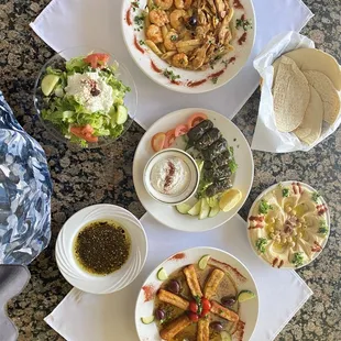 Fried Cheese Grape leaves shrimp and chicken pasta Hummus salad Zatter pita bread