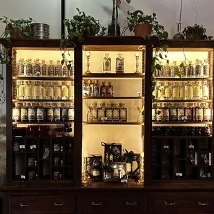 a shelf of liquor bottles