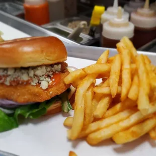 Buffalo Style. Chicken, Garlic Herb Aioli, Lettuce, Tomato, Red Onion, Blue Cheese Crumbles, Buffalo Sauce.