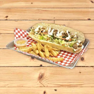 a sandwich and fries on a tray