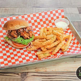a burger and fries on a tray