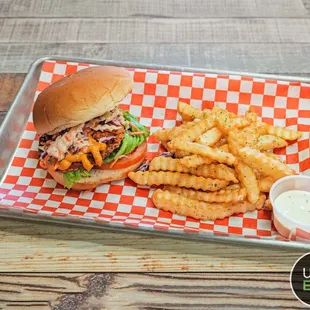 a burger and fries on a tray