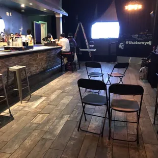 a bar with chairs and tables