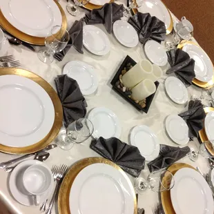 Guest table setting with gold chargers
