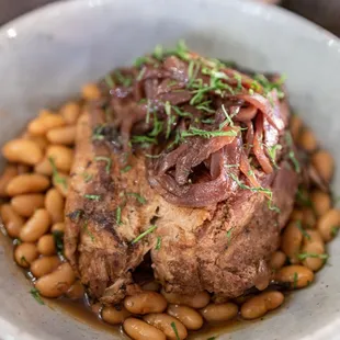 Pork &amp; Beans ($36)
 Slow braised pork shoulder, Peruvian white beans, balsamic pickled red onion