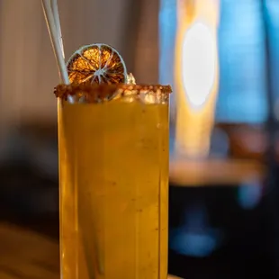 Jungle Fever ($15) Mezcal, mango purée, lime, sumac chili syrup, Tajin