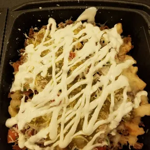 New Asada fries.  Amazing. Fresh cooked fries.