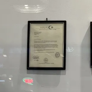 two framed menus on a wall