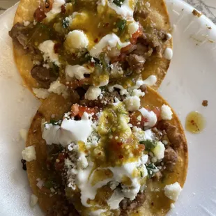 Tostada : beans lettuce tomato, cheese salsa.