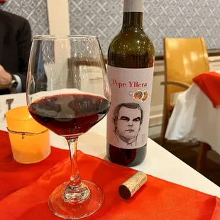 a glass of wine and a bottle of wine