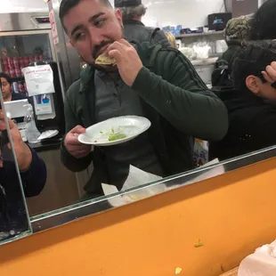 a man eating a sandwich