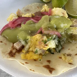 Egg and ham taco with salsa and toppings