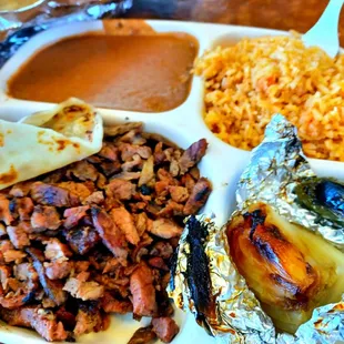 Carne Asada Combination.  Ooooh the fresh hot flour tortillas are !  They have corn too. $9.99 and bring a empty stomach.