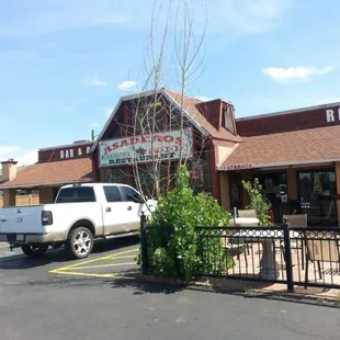 a truck parked in front of the restaurant