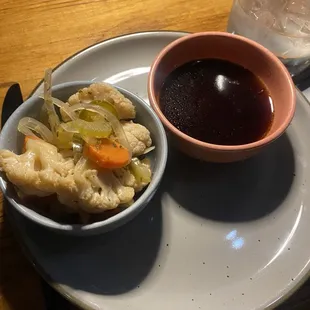 Au jus type dipping sauce and pickled veggies that came with beef short rib