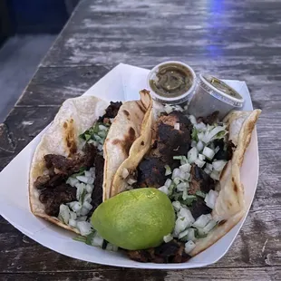 Smoked Brisket en Mole Tamarindo Taco and lamb barbocoa taco