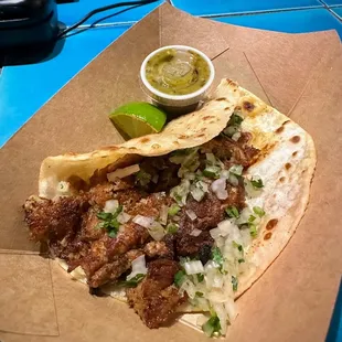 a taco with a side of salsa