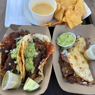 two tacos and chips on a tray