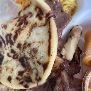 a plate of food with meat and rice