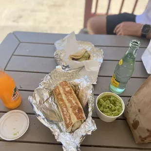 Crispy supreme steak burritos , steak tacos, and Guacamole and chips