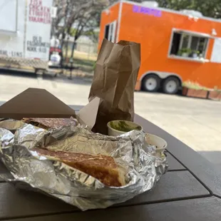 a hot dog and a sandwich on a table