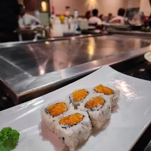a plate of sushi on a counter