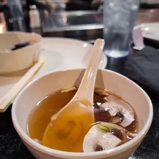 a bowl of soup with a spoon in it
