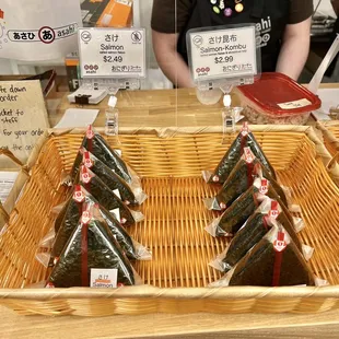 a display of sushi rolls in a basket