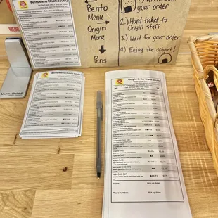 a menu and a basket on a table