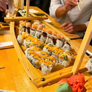 a sushi boat full of sushi