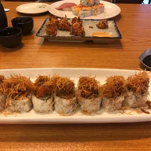 Fire Crunch Roll, Crab Cakes , Volcano Roll , and Toro