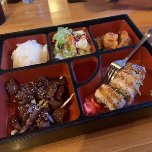 a bento box of food