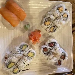 Smoked salmon nigiri, spicy crab roll, avocado roll, and spicy tuna roll.