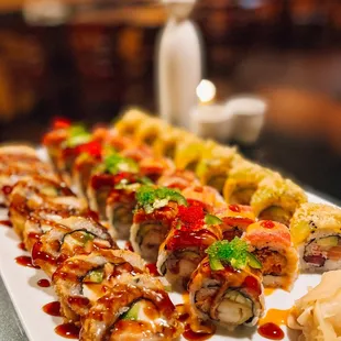 a platter of sushi rolls and chips