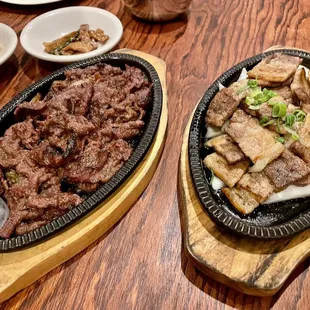 two plates of food on a wooden table
