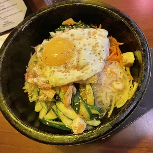 Hey beautiful, sizzling chicken bibimbap served in a bowl large enough to feed a small family, as long as the family isn't too hungry.