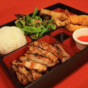 a bento box with a variety of food items