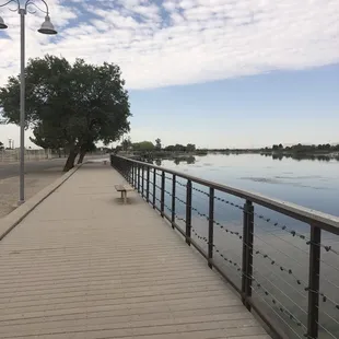Benches around walking trail in front of the lake