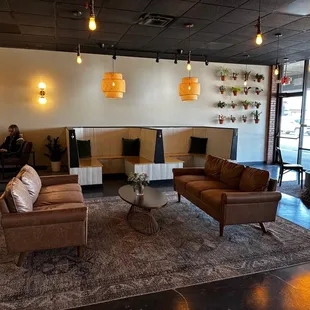a coffeehouse with a coffee table and couches
