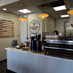 a coffee shop counter with a coffee maker