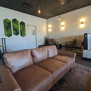a living room with a brown couch