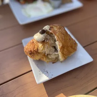 a croissant on a plate